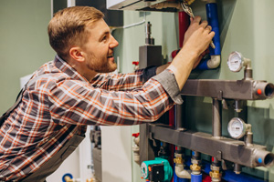 A man repairing boiler